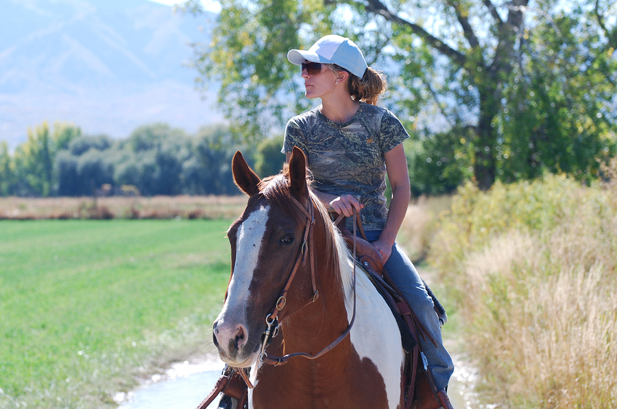 Woman Riding Paint Horse
